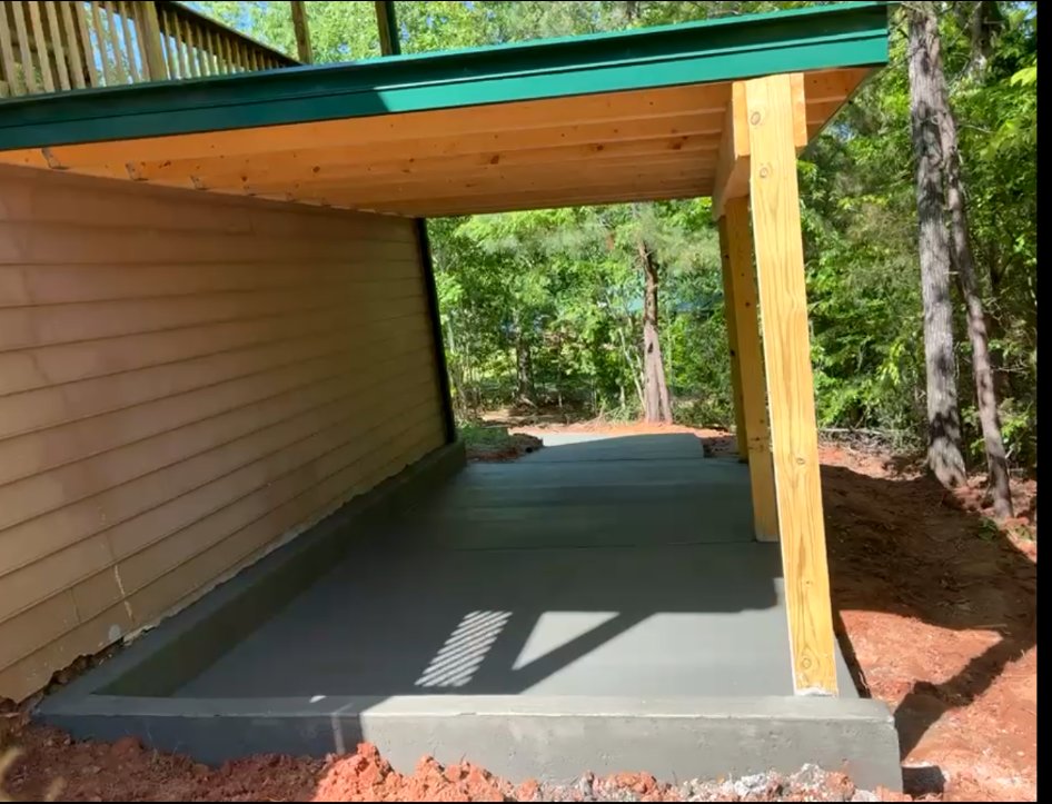Finished carport concrete slab beneath a roof