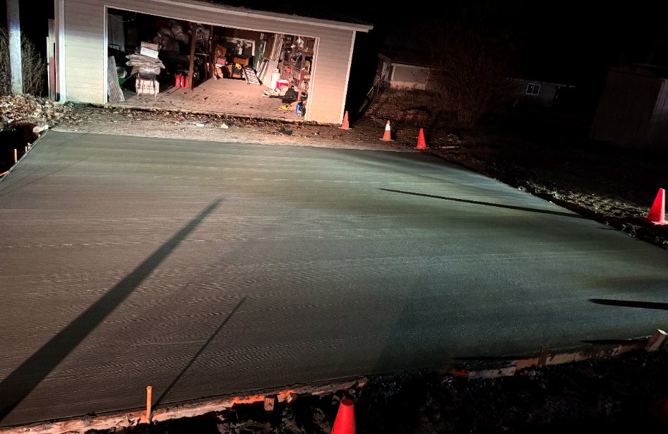 Fresh residential driveway concrete placement.